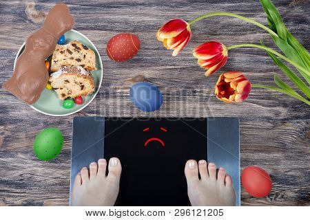 Female Feet On Digital Scales With Sad Smile Surrounded By Easter Food (easter Cake, Chocolate Easte