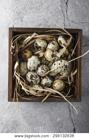 Quail Eggs. Flat Lay Composition With Small Quail Eggs In The Wooden Box On The Concrete Background.