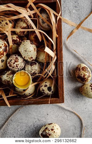 Quail Eggs. Flat Lay Composition With Small Quail Eggs In The Wooden Box On The Concrete Background.