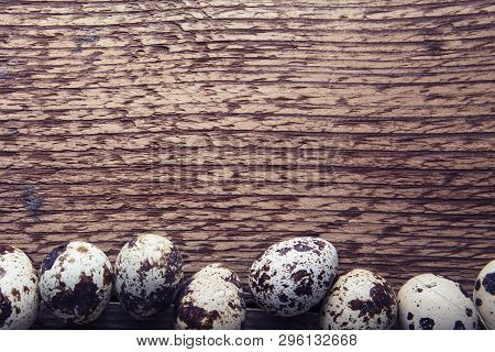 Quail Eggs. Flat Lay Composition With Small Quail Eggs On The Natural Wooden Background. One Broken