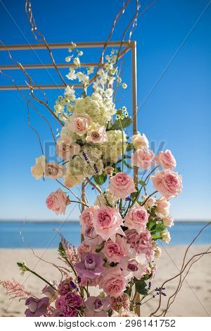 Event Decoration. Wedding Chuppa At Riverside Decorated With Fresh Flowers. Florist Workflow.