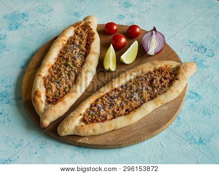 Arabic Pizza Lahmacun On Blue Background. Top View.