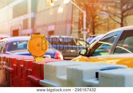 Roadblock Or Construction With Signal On A Road Red And White Street Barricade.