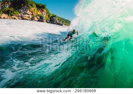 April 18, 2019. Bali, Indonesia. Surfer Ride On Barrel Wave. Professional Surfing At Big Waves In Pa