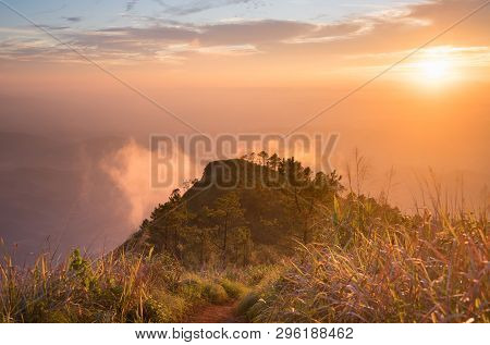 Gold Sunset Light Phu Nom At Phu Langka National Park Thailand With Fog On Sky. Phu Nom At Phu Langk