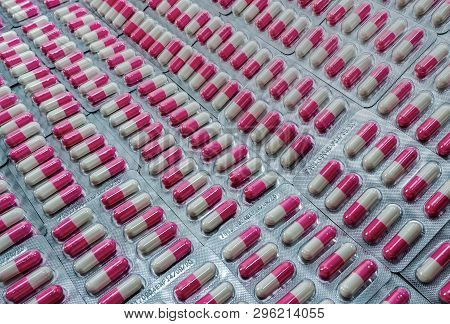 Closeup Pink-white Antibiotic Capsule Pills In Blister Pack. Antibiotic Drug Resistance. Pharmaceuti