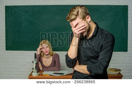 He Is So Shy. Male Student With Examiner At Examination. High School Student Saying Lesson. Handsome