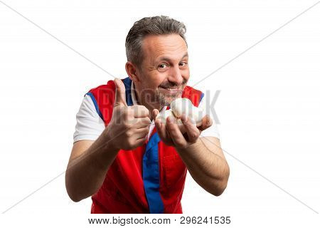 Friendly Grocery Store Or Supermarket Male Employee Showing Thumb Up As Like Gesture To Garlic Isola