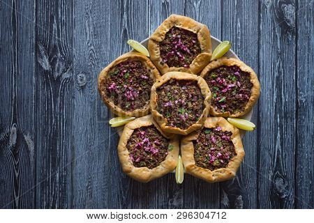 Open Meat Pies On Dark Wooden Background. Top View.