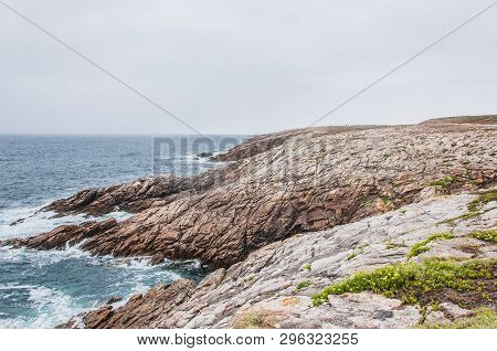 Beach And Cliff In Quiberon In The Morbihan In France, On The Peninsula Of Quiberon
