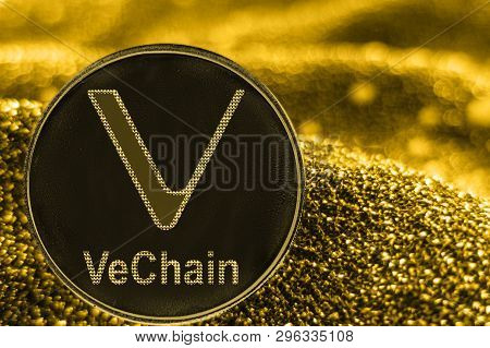 Coin Cryptocurrency Vet Vechain And Gold Fabric Background.