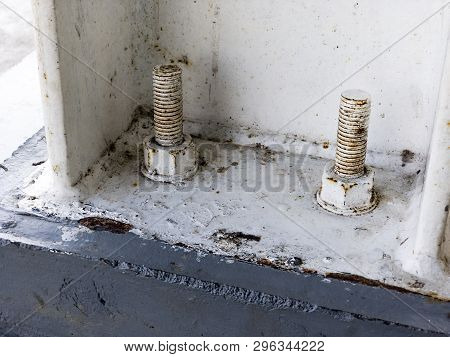 White Concrete Sill Anchor Bolt On Concrete Foundation. Two Concrete Bolts For Fixing Supported Conn