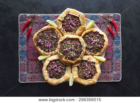Open Meat Pies On A Black Background. Top View