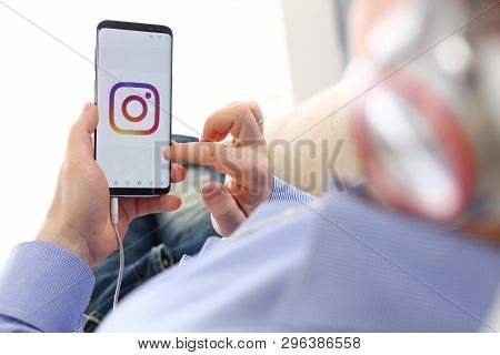 Minsk, Belarus - December 25, 2018: Male Arm Hold Samsung Galaxy S9 Phone With Instagram Social Netw