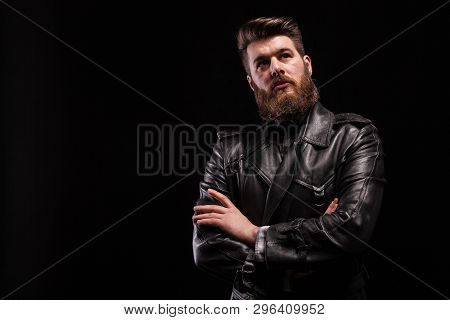 Attractive Bearded Man Keeping His Arms Crossed Over Blac Background