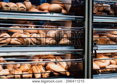 Background - Shelves In A Grocery Store With Fresh Bread Of Different Varieties In Muted Colors