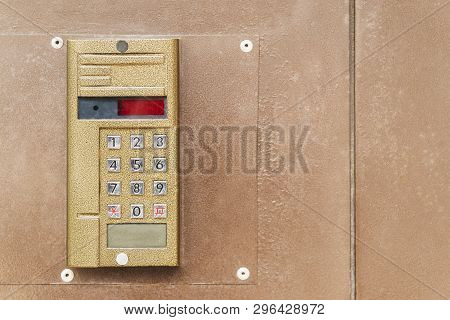 Metal Vandal-proof Intercom On An Old Metal Door, Close-up