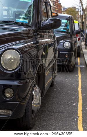 London, Great Britain. April 12, 2019. Kensington Street. Cab Parking. London Cab Is Considered The 