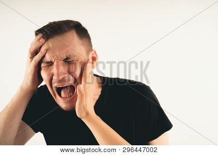Crop Person Slapping Scared Man In Face
Emotional Male Getting Slapped In Face While Shouting With C
