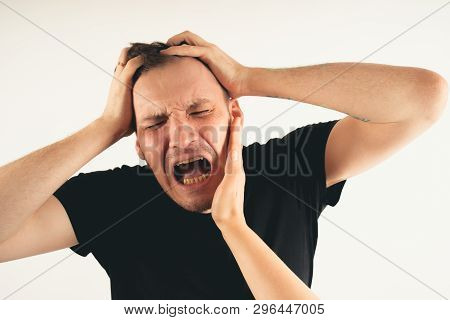 Crop Person Slapping Scared Man In Face
Emotional Male Getting Slapped In Face While Shouting With C
