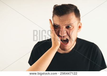 Crop Person Slapping Scared Man In Face
Emotional Male Getting Slapped In Face While Shouting With C