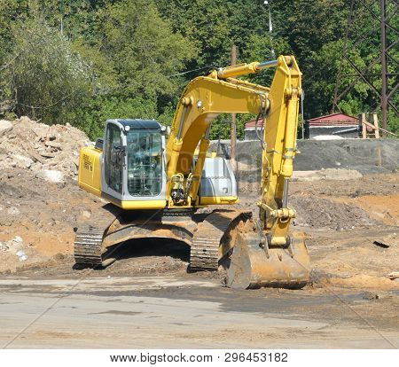 Track-type Excavator On Ground  At Dry Sunny Summer Day