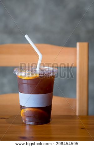 Orange And Coffee Cocktail With Ice On Wood Table