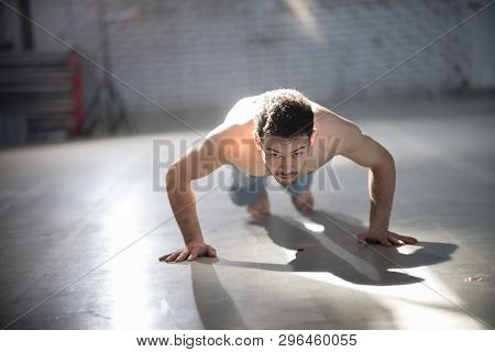 An Athletic Man On Capoeira Training Doing Push Ups