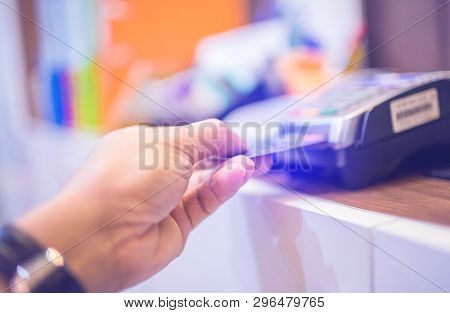 Hand Put Credit Card In Slot Of Credit Card Reader, Credit Card Payment