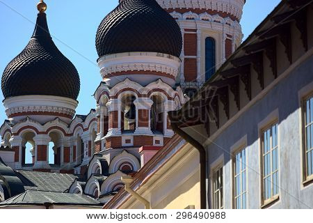 Alexander Nevksy Orthodox Cathedral Domes Above Tallinn Old Town And Standing Out Before Blue Sky