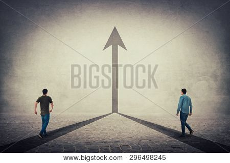 Two Men Walking On A Pavement Road And Pathways Join Together And Transform Into A Straight Arrow Go