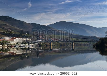 View Of The Pinhao Village With Terraced Vineyards And The Douro River, In Portugal; Concept For Tra