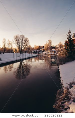 Cold Winter Morning By The River In Forssa Finland With Calm Water