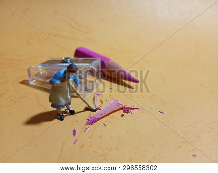 Photo 1 Woman Cleaning Trash From Pencil Sharpener With Negative Space