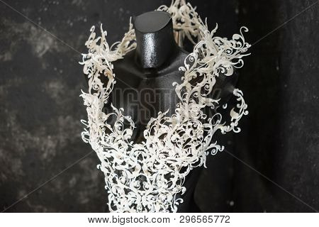 Piece made with 3d printer, is composed of white flowers that form a corset, handmade, fantasy design Baroque style