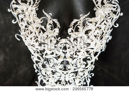 Piece made with 3d printer, is composed of white flowers that form a corset, handmade, fantasy design Baroque style