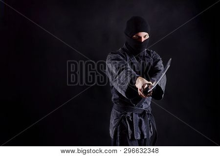 Ninja With Katana Portrait On A Dark Background