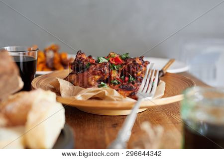 Low Angle View Of Table Served With Traditional British Sunday Roast Dinner, Featuring Roasted Chick