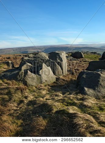 Exposed Rocks And Boulders On Bridestones Moor In West Yorkshire In Sunlight And Shadow