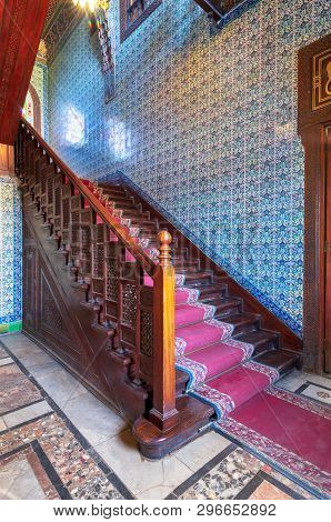 Cairo, Egypt - December 2 2017: Wooden Staircase With Ornate Red Carpet, Decorated Wooden Balustrade