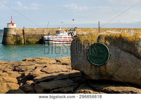 Barfleur, France - August 29, 2018: A Large Medallion Fixed To A Rock In The Harbour Marks The Norma