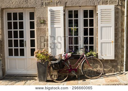 Barfleur, France - August 29, 2018: Medieval Granite Houses And Bikes In Barfleur. Normandy France