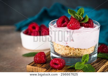 No Baked Cheesecake With Raspberry In Glass Jar. Healthy Dessert.