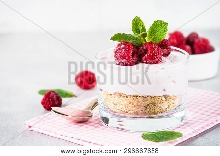 No Baked Cheesecake With Raspberry In Glass Jar. Healthy Dessert.