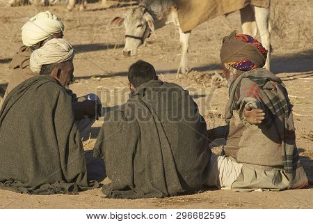 Nagaur, Rajasthan, India - February 14, 2008: Preparing Food And Arming Up After A Cold Night Campin