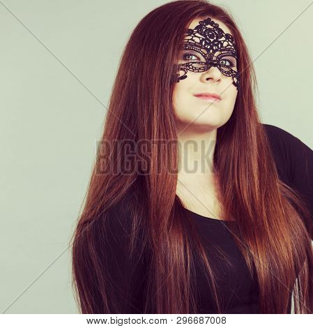 Pretty Mysterious Woman Wearing Black Eye Lace Mask Having Long Brown Hair.