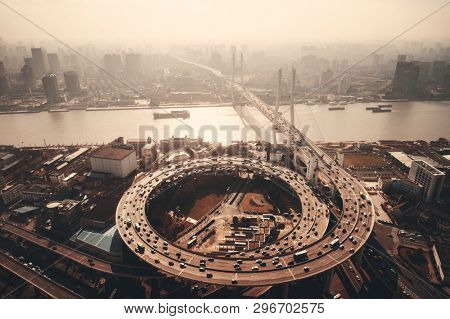 Shanghai Nanpu Bridge over Huangpu River with busy traffic in China.