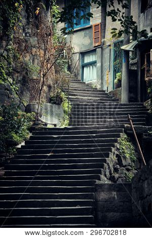 Stairs and tree in Xiahao Old street in Chongqing, China.