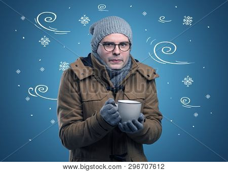 Young hipster frozen boy with doodled snowflakes and windy concept