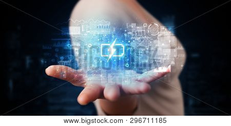 Elegant hand holding battery with full of energy